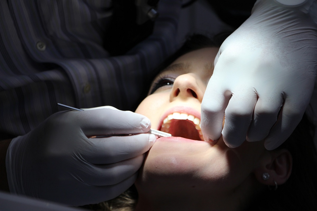 Dentist Inspecting Teeth