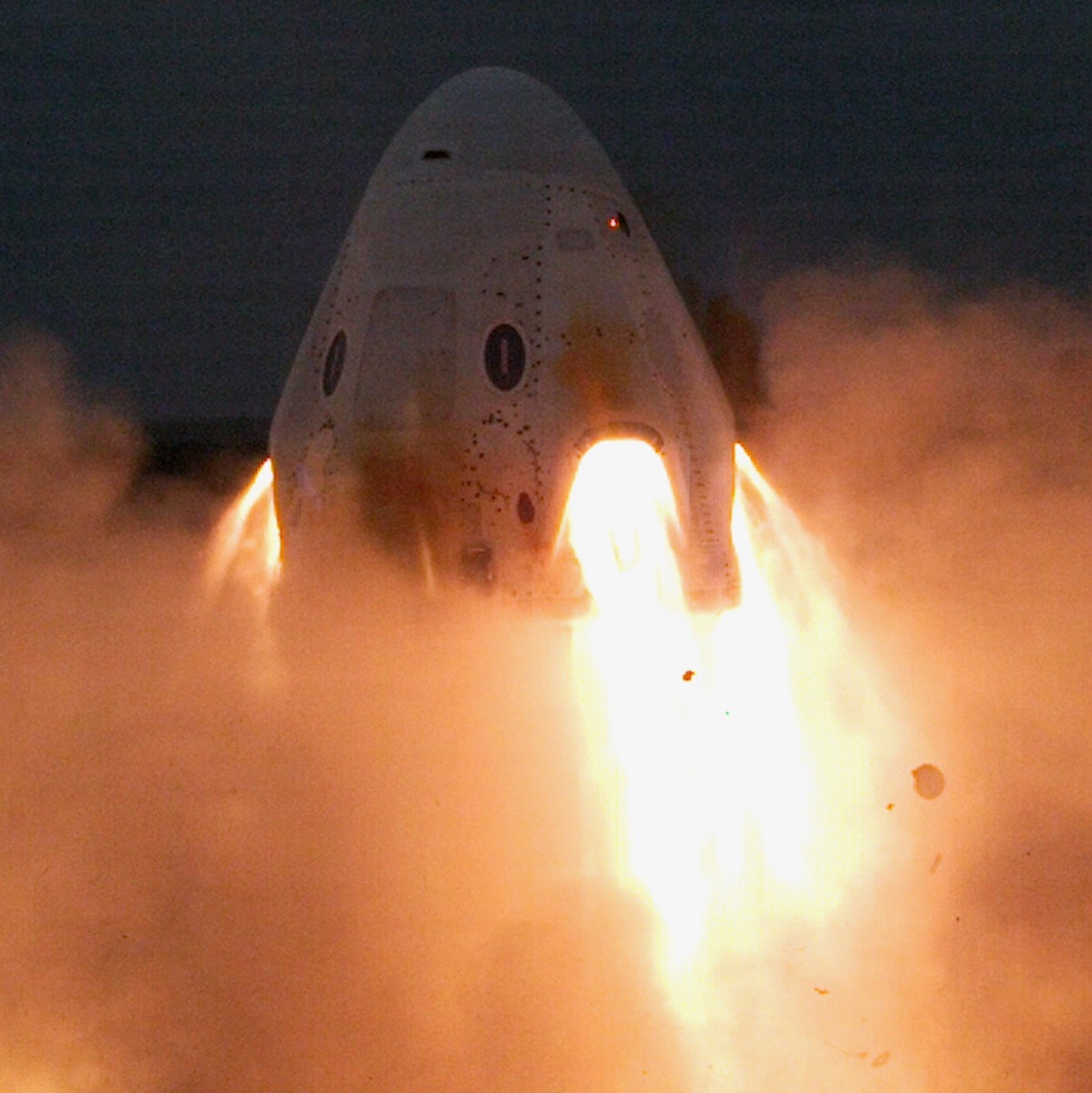 SpaceX' Crew Dragon's thrusters blaze during test fire
