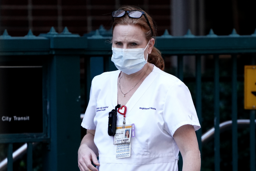 Nurse walks out of hospital in New York City