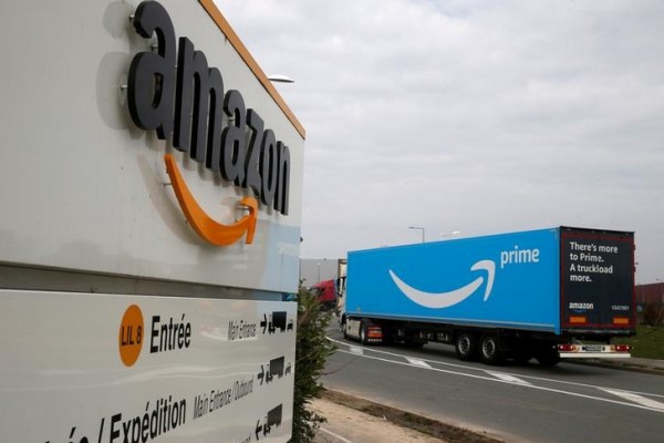 A truck bearing the Amazon Prime logo arrives at the Amazon logistics center in Lauwin-Planque