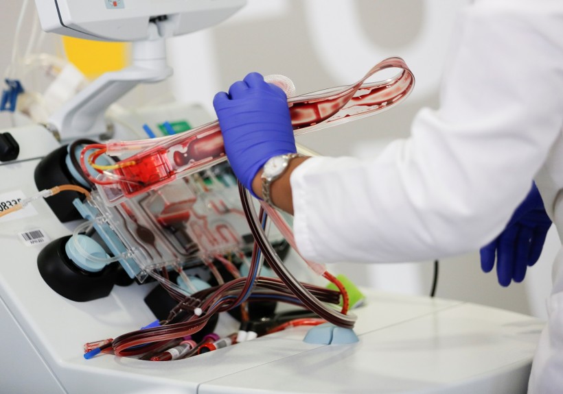 Phlebotomist Wilson takes apart an apheresis kit after processing convalescent plasma for an experimental treatment study during the coronavirus disease (COVID-19) outbreak in Seattle