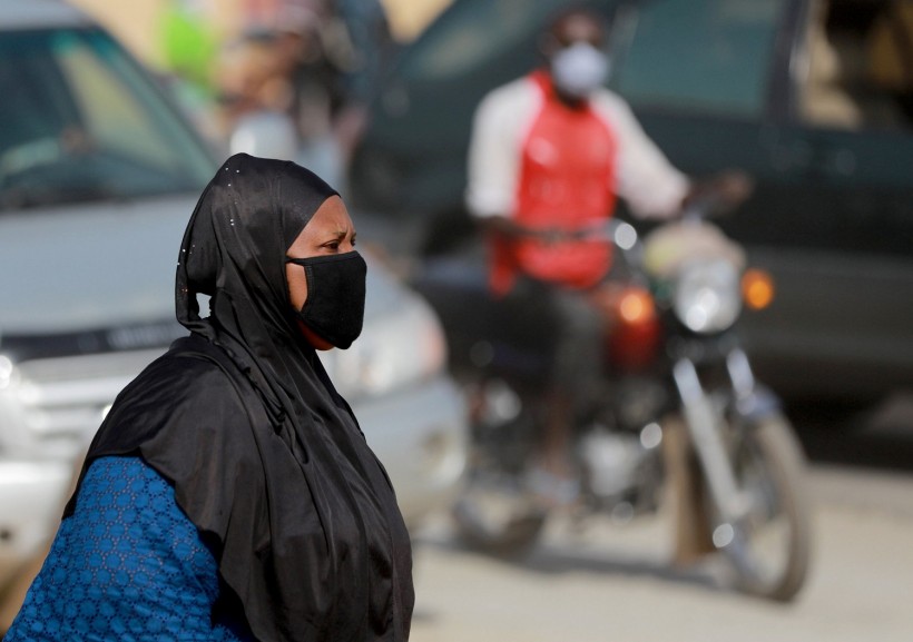 A woman wears a face mask at Dutse Alhaji market, as authorities race to contain the coronavirus disease (COVID-19) in Abuja