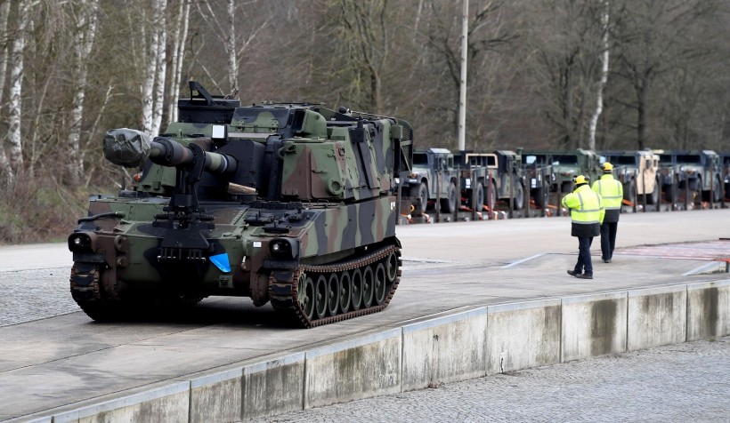 Soldiers of German Army Bundeswehr load a U.S. M109 tank onto a heavy goods transporter during preparations for the Defender-Europe 20 international military exercises in Bergen Hohne