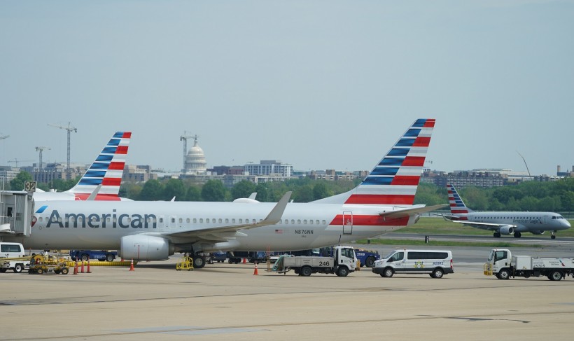 An American Airlines Boeing 737 jet sits at a gate at Washington's Reagan National airport