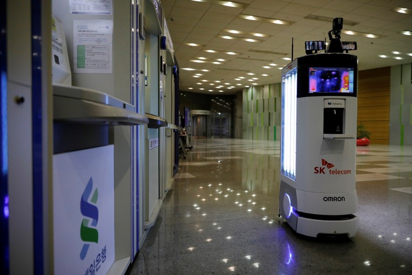 A self-driving robot sanitizes automated teller machines with UV light during its demonstration at the headquarters of SK Telecom in Seoul