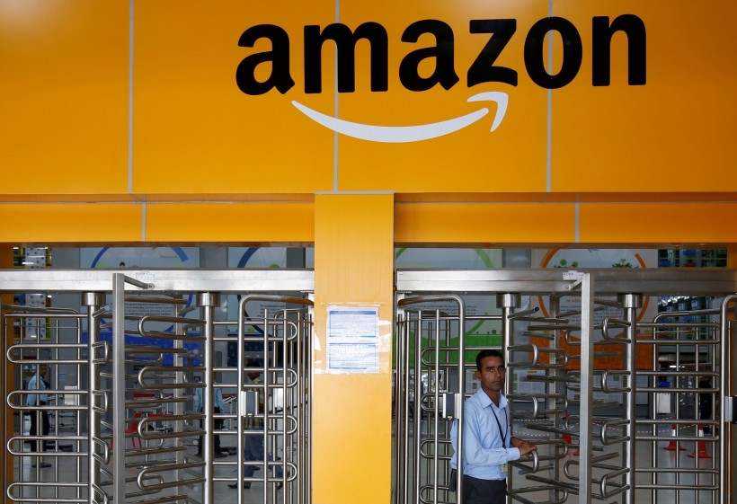 An employee of Amazon walks through a turnstile gate inside an Amazon Fulfillment Centre (BLR7) on the outskirts of Bengaluru