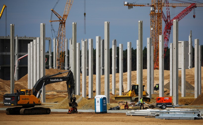 Cranes and first pillars for the future Tesla Gigafactory in Gruenheide near Berlin