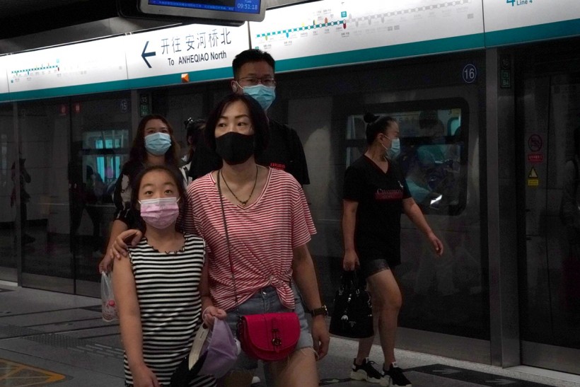 People wearing face masks are seen inside a subway station, following the coronavirus disease (COVID-19) outbreak, in Beijing