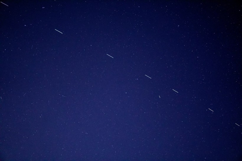 The Starlink 3 train rides across the early morning sky, accompanied by a handful of other satellites.