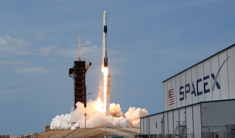A SpaceX Falcon 9 rocket and Crew Dragon spacecraft carrying NASA astronauts Douglas Hurley and Robert Behnken lifts off