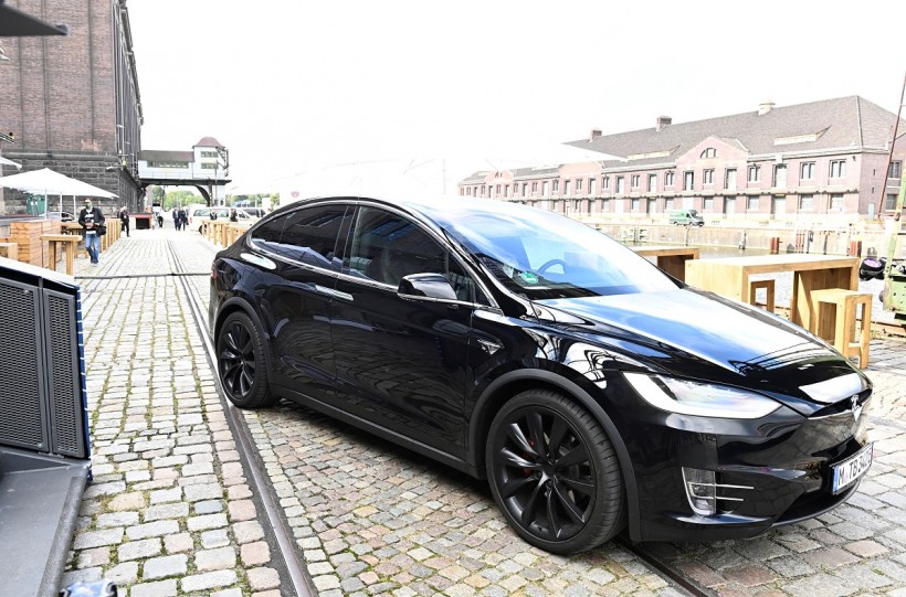 Elon Musk arrives in a Tesla car to attend a meeting with the leadership of the conservative CDU/CSU parliamentary group, in Berlin