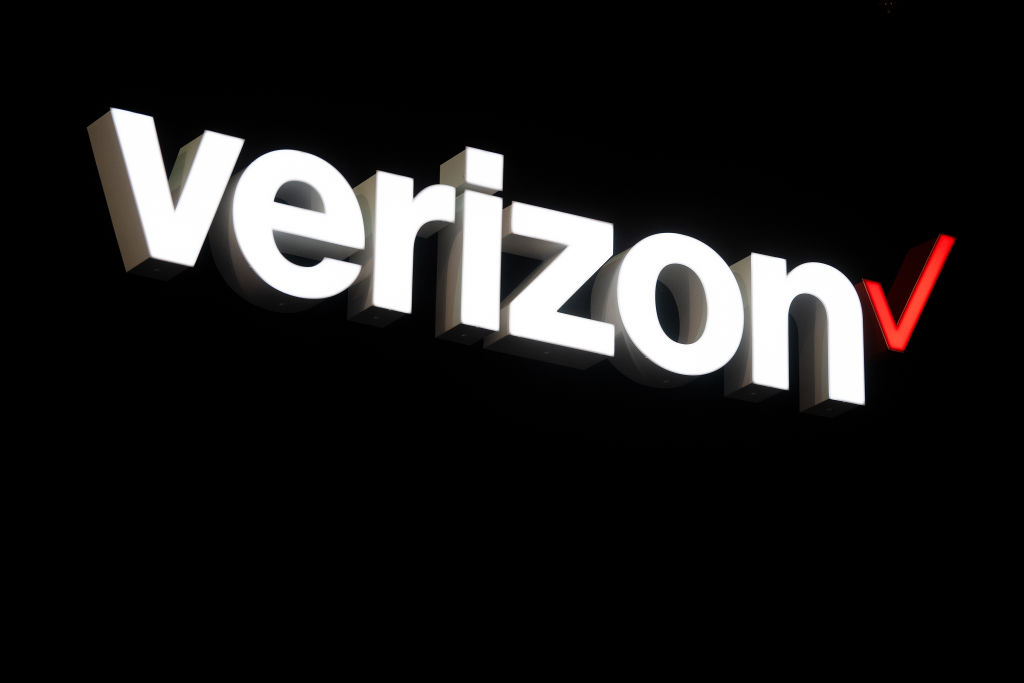 A logo sits illumintated outside the Verizon booth on day 2 of the GSMA Mobile World Congress 2019 on February 26, 2019 in Barcelona, Spain.