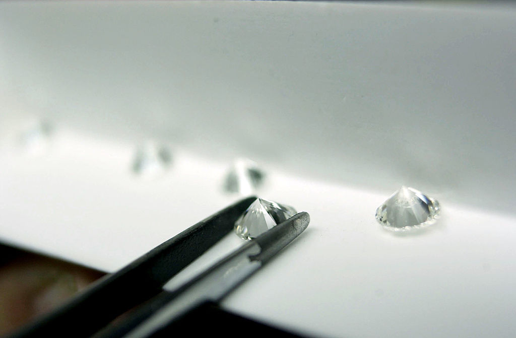 A Diamond Factory Employee Sorts Polished Diamonds