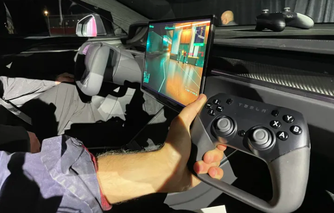 Elon Musk Plays ‘Cyberpunk 2077’ on Tesla Model S Plaid To Flaunt Gaming Performance— Tesla Branded Controller Seen? 
