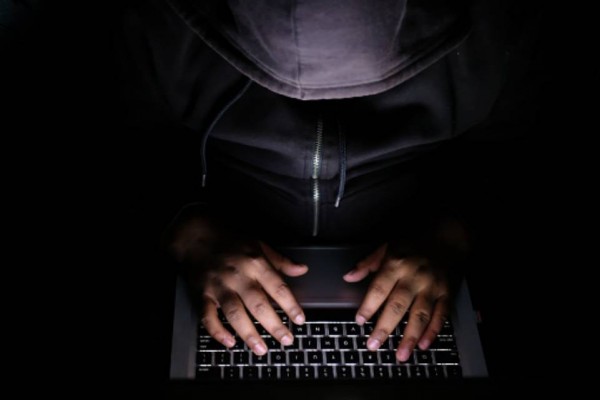 Hacker on laptop 