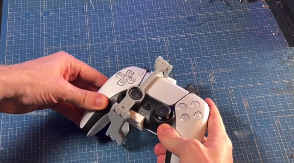 YouTuber Designs One-Handed PS5 DualSense Attachment For Players Who Want to Eat Snacks Without Hitting the Pause Button