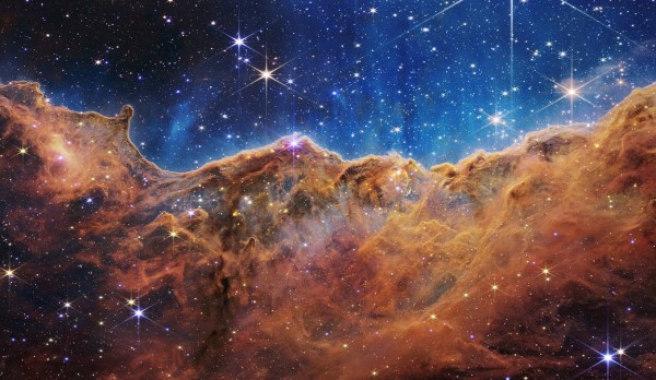 A capture of a giant star-forming region dubbed the “Cosmic Cliffs” located within the Carina Nebula. The Cosmic Cliffs were captured by James Webb. Photo courtesy Nasa/Esa/Csa/STSCI