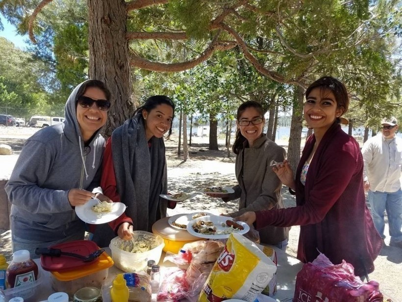 Rebecca Singh (right) and Venezuelan ex-students (left), together with a friend, at a barbecue near Olivet's campus.