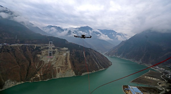 UAV Stretches Cable Across Dadu River For Bridge In Ya'an