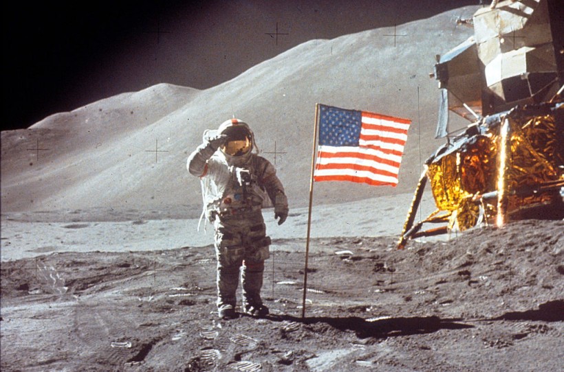 Astronaut David Scott Salutes by U.S. Flag