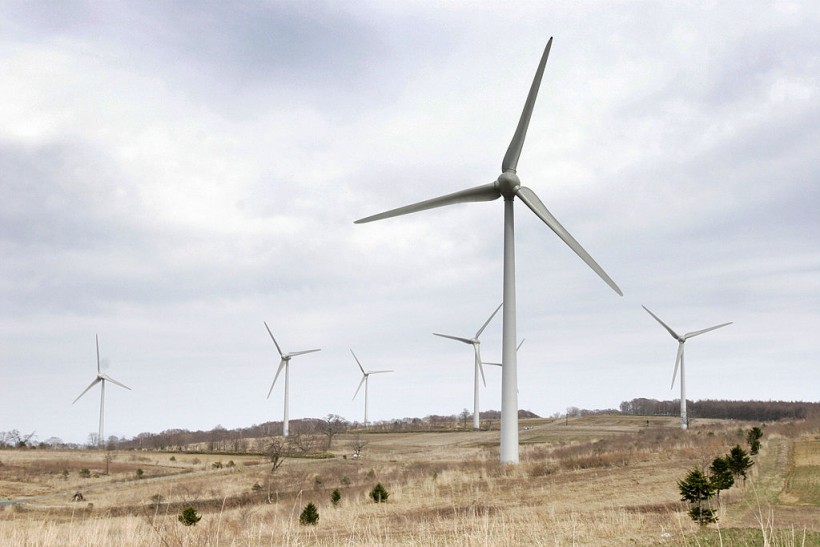 Wind turbines generate electricity on th...