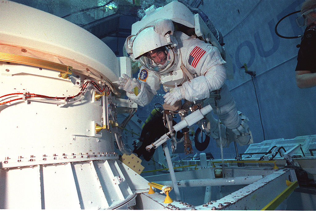 Astronaut Daniel T Barry Mission Specialist Wears A Training Version Of The Extravehicular Mobili