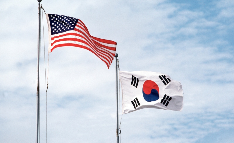 The US and Sough Korean flags fly side-by-side symbolizing the joint efforts of the two nations.