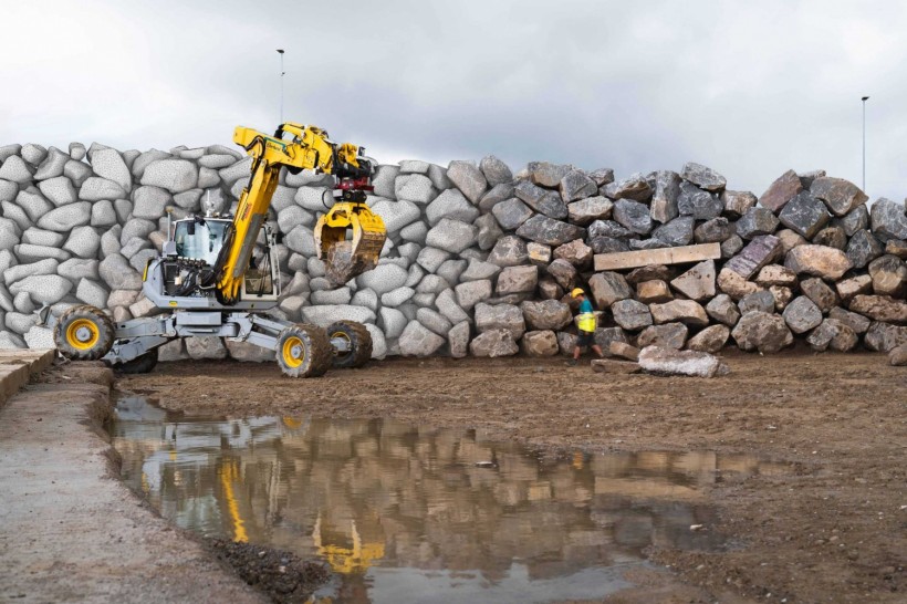 Autonomous excavator constructs a six-metre-high dry-stone wall