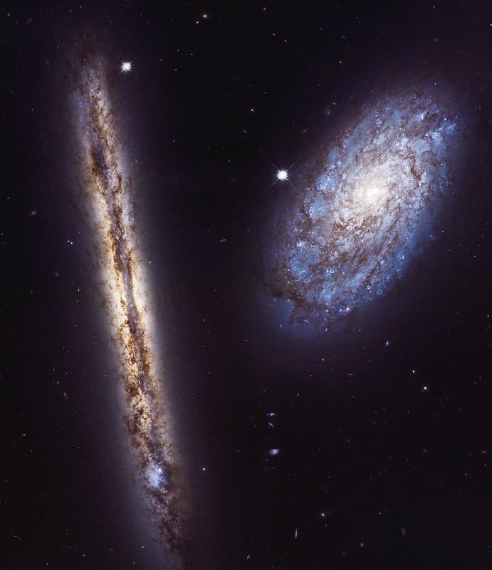 Starry Pair: NASA's Hubble Captures Stunning Portrait of Spiral Galaxies Resembling Milky Way