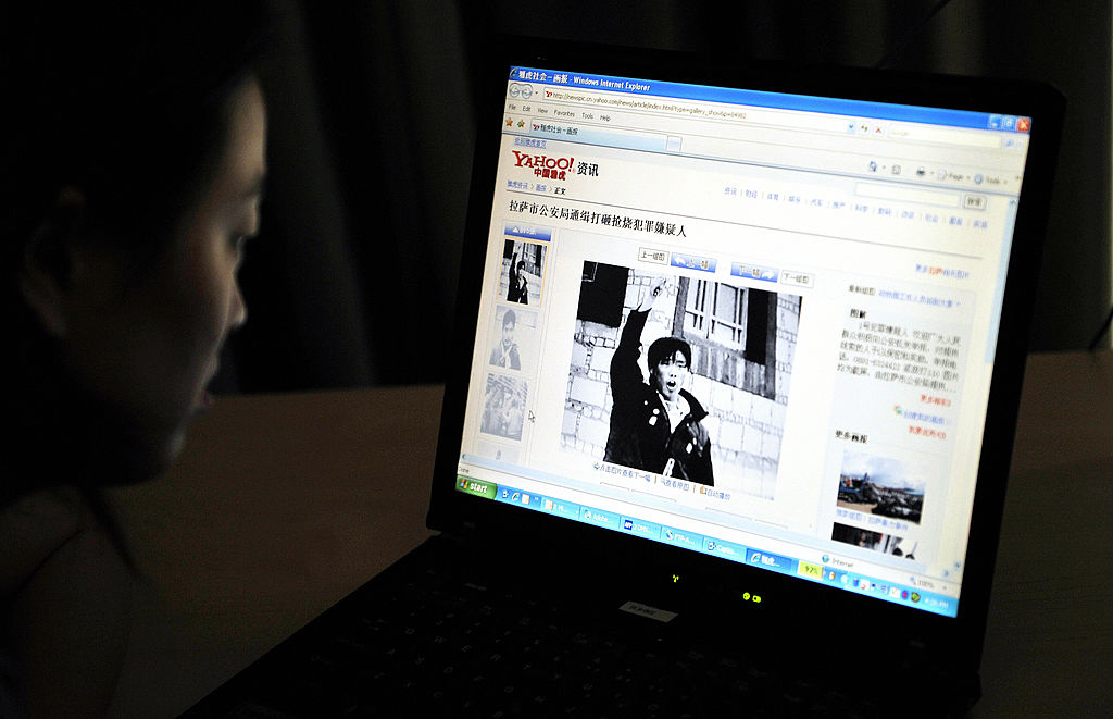 An internet user reads a website in Beij