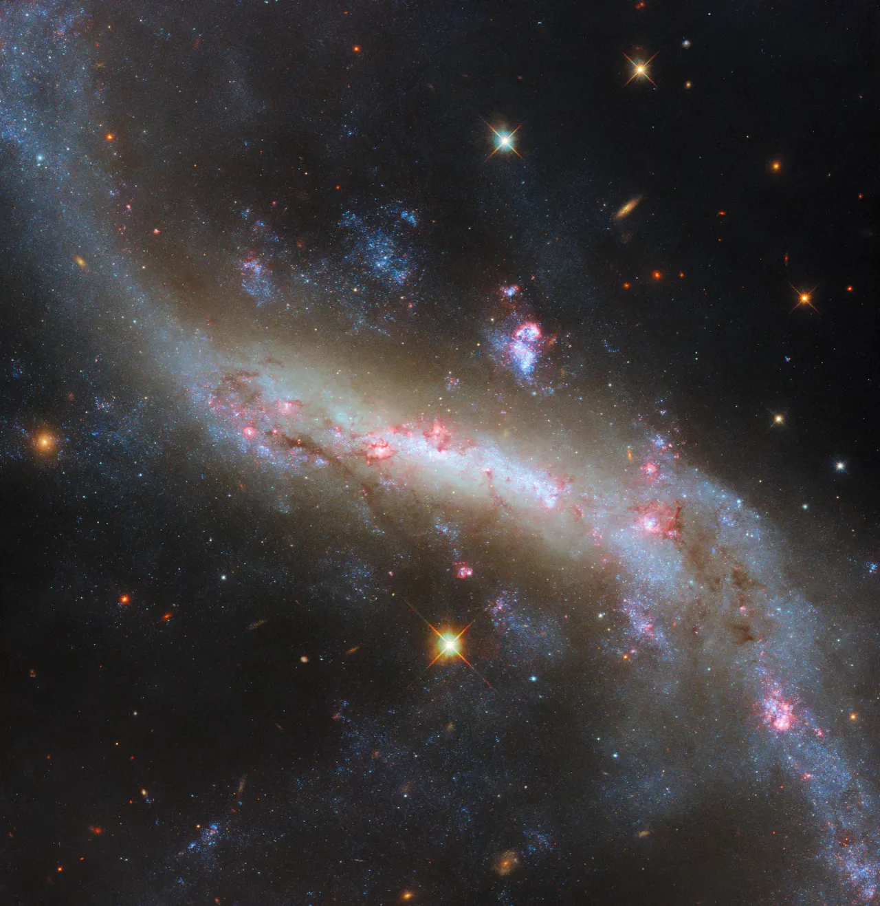 NASA's Hubble Space Telescope Captures Mesmerizing Image of Sweeping Spiral Galaxy 43 Million Light-Years From Earth